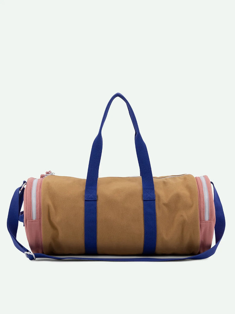 A Sticky Lemon Duffle Bag from the Adventure Collection in Cousin Clay color, with blue straps and a light pink zipper, isolated on a white background.