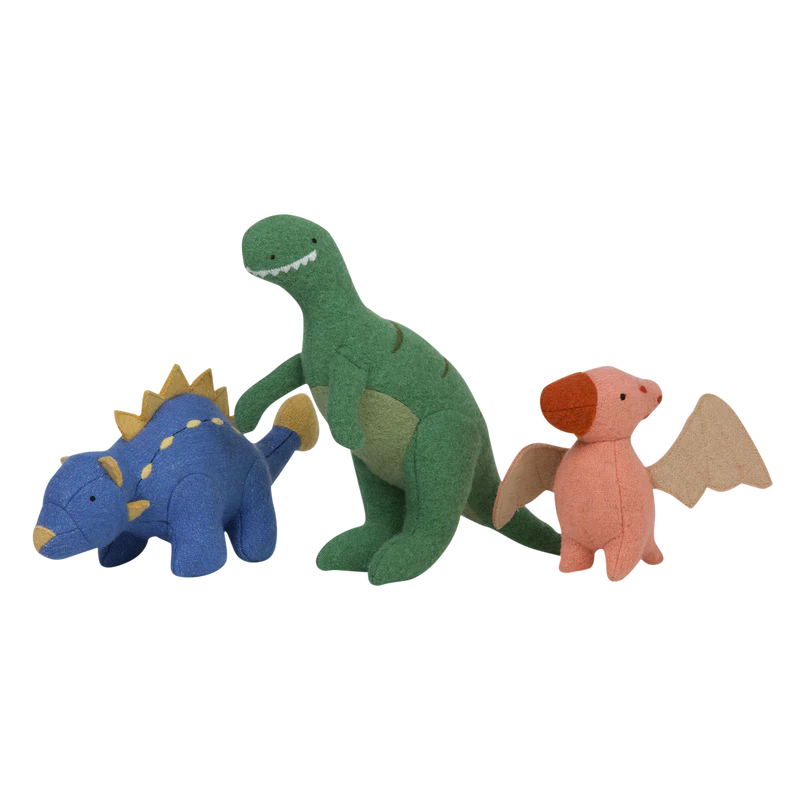 Three Olli Ella Holdie Pre-Historic Animals on a black background, including a green T-Rex, a blue Ankylosaurus, and a brown Triceratops.