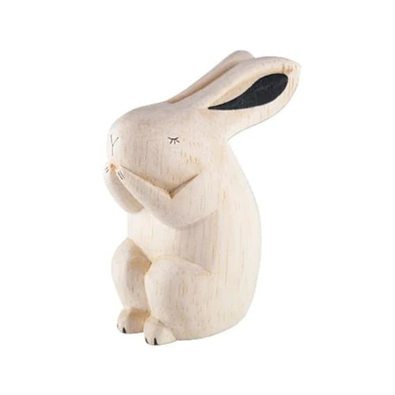 A handcrafted Handmade Tiny Wooden Forest Animals - Bunny standing upright with its paws held in front, featuring simple carved details and a soft white finish.