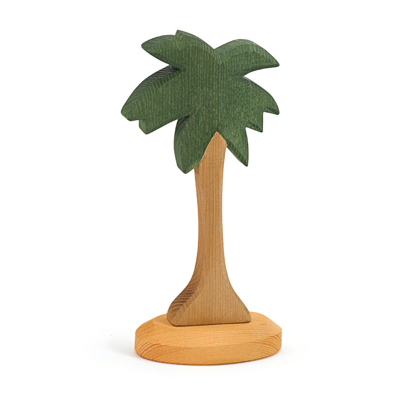 A handcrafted Ostheimer Palm Tree with Stand with a textured green crown and a smooth brown trunk, standing upright on a flat base.