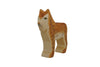 A small wooden toy figure painted to resemble a standing lynx. Crafted by Holzwald Brand, the lynx has distinct spots, a light brown body, and a detailed face with prominent eyes. This sustainable toy is both charming and eco-friendly.