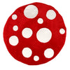 A delightful Meri Meri Mushroom Hat - Final Sale, designed with a round red base and white polka dots of varying sizes scattered across its surface, perfect for imaginative play in a woodland wonderland setting.