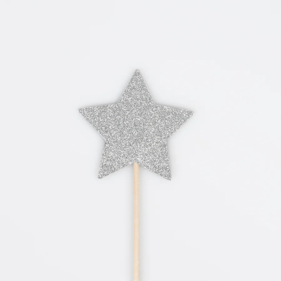 A silver glittery star attached to a thin wooden stick, set against a plain white background, resembling a wand. The star's upright and centered position makes it ideal for Meri Meri Wizard Party Hats & Wands - Final Sale.