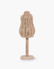 The Minikane Mannequin For Doll Clothing stands on a round wooden base, perfect for any dressing room. This torso-shaped miniature mannequin features an intricate woven pattern and is mounted on a smooth wooden pole. The plain white background emphasizes the natural materials and craftsmanship of the mannequin.