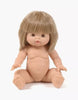 A Minikane Baby Doll (13") - Zoe, featuring straight, light brown hair and bangs, is sitting upright with arms and legs slightly spread out. The anatomically correct doll has detailed facial features, including a small nose and pink lips, set against a plain white background. Note that clothing is sold separately.