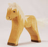 A Ostheimer Horse with a simplistic design, featuring a pale natural wood finish and a fluffy white tail, standing against a neutral backdrop. This handcrafted wooden toy encourages imaginative play.