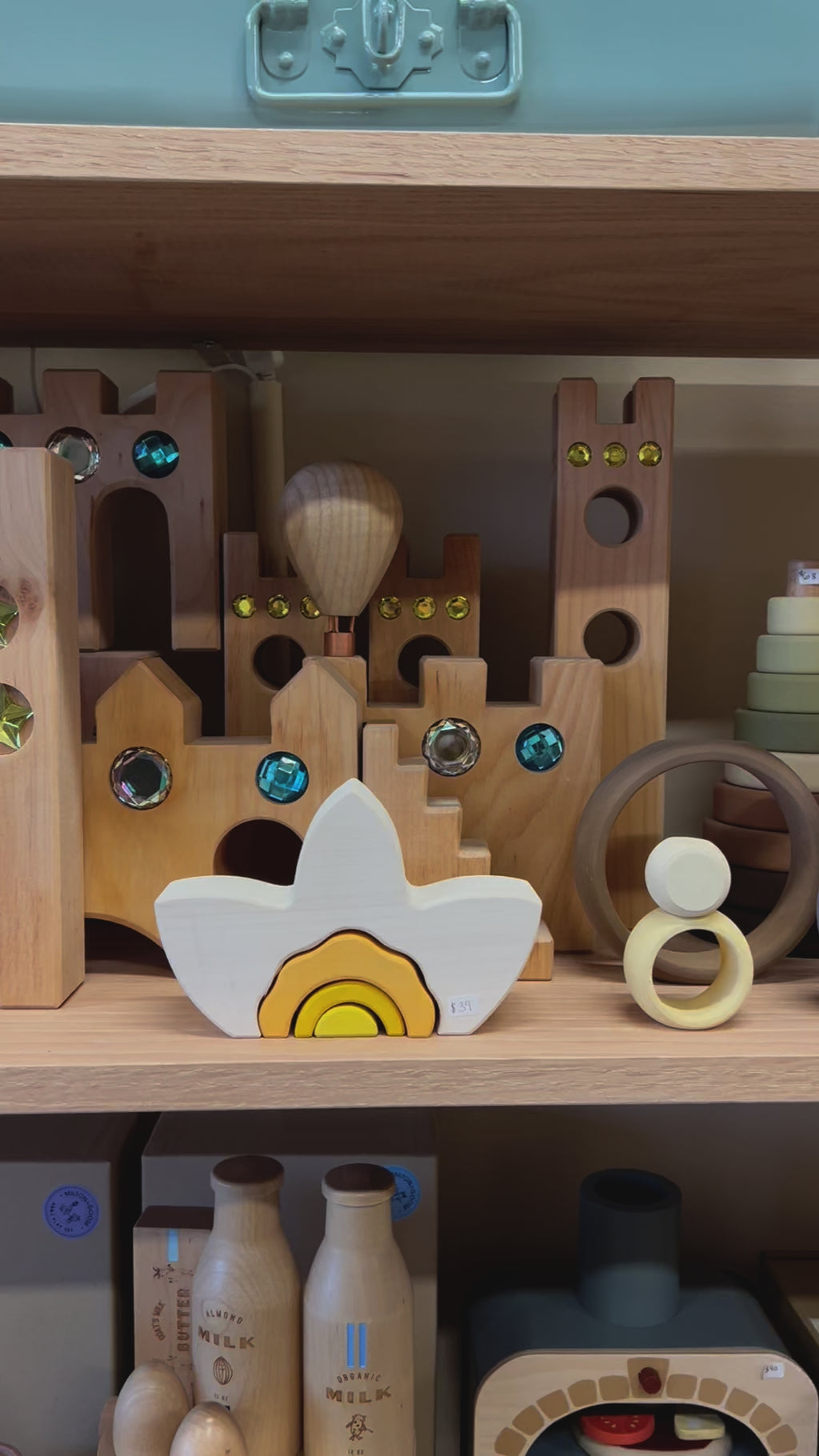 Wooden castle toy with gem inserts