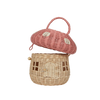 A whimsical handwoven Olli Ella Mushroom Basket in Pink designed to resemble a cottage, featuring a pink roof, windows, and a door, complete with a wooden latch and handle.