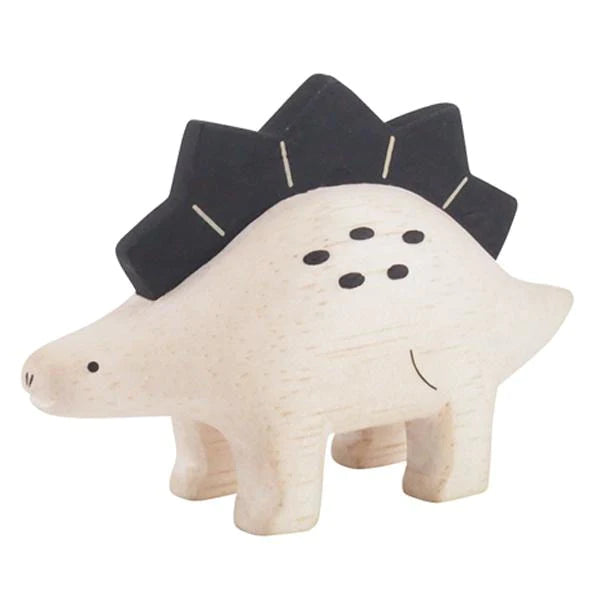 A handmade tiny wooden Stegosaurus figurine, crafted from light-colored Albizia wood with dark painted details on its back and face, standing on a plain background.