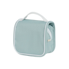 A light blue, soft Olli Ella See Ya Wash Bag in steel blue with a white handle and zipper, perfect as a travel buddy, isolated on a transparent background.