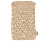 The Maileg Bath Mat is a beige, loosely knitted, rectangular handmade bath mat featuring a label on the lower right corner. Its pattern consists of interlocking loops, giving it a textured and open appearance. The material appears to be natural fiber, possibly jute or cotton.