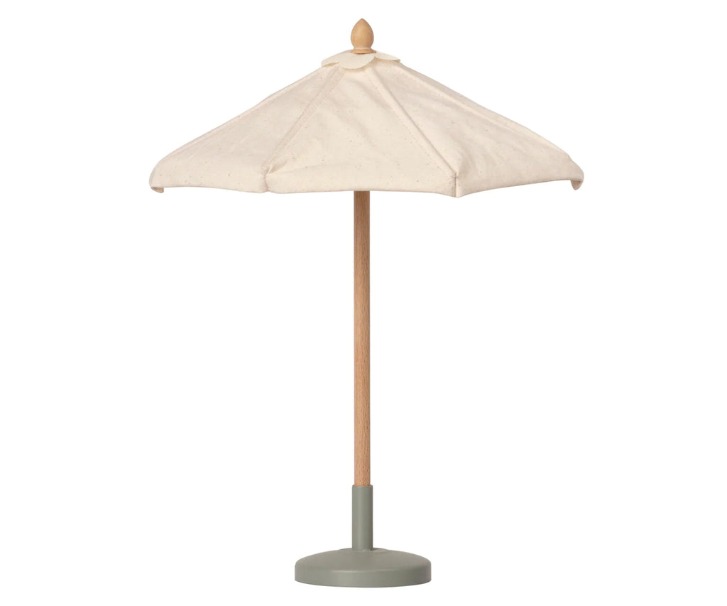 A Maileg Miniature Sunshade with a wooden pole and a gray round base. The umbrella has a simple, elegant design and appears perfect for creating a cozy atmosphere in your miniature garden set or terrace playsets.