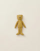 A simple Maileg Teddy Junior with a vintage look on a plain white background. The Maileg Teddy Junior has a light brown color, small black eyes, and a tiny black nose, with outstretched arms and legs. Its minimalist design captures the essence of soft linen, evoking memories of an old-time teddy bear family.