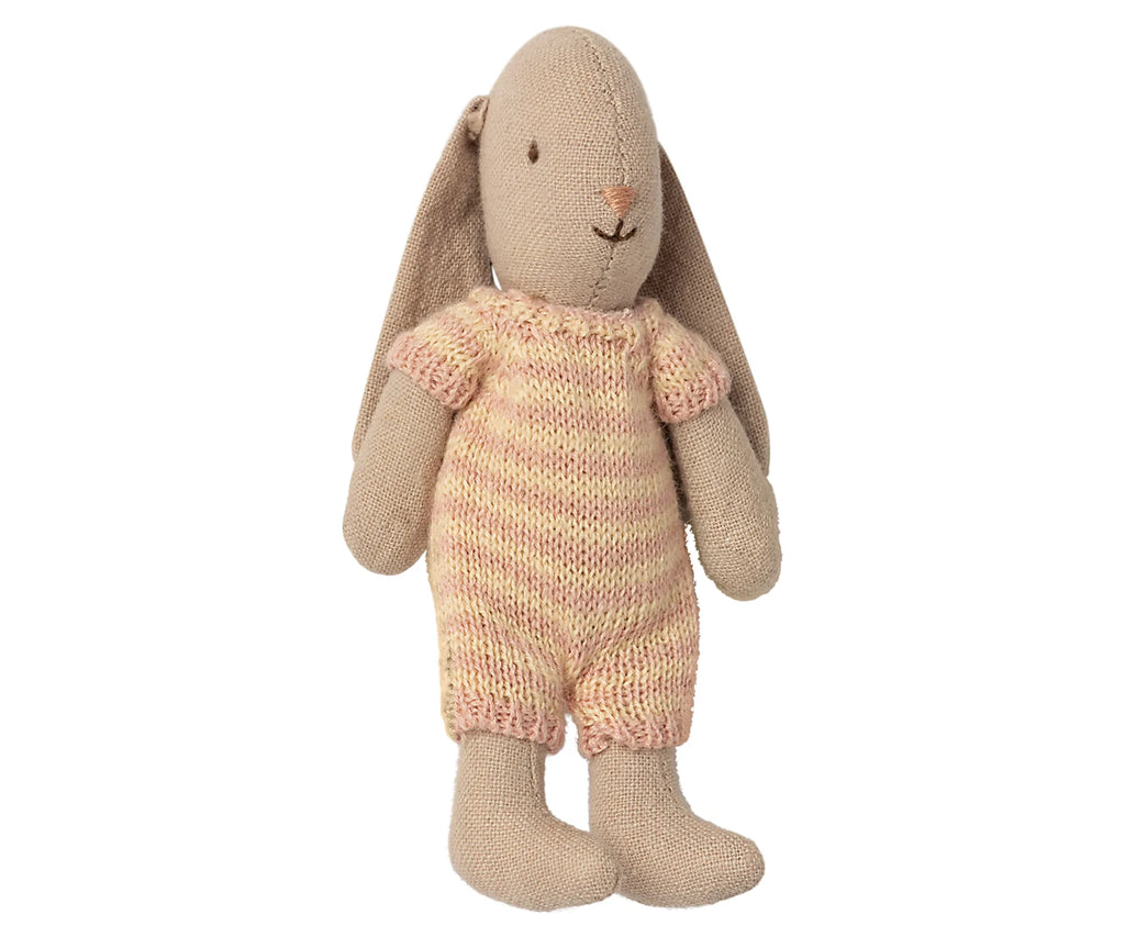 A Maileg Micro Bunny with a knitted pink and yellow striped suit standing against a plain white background.