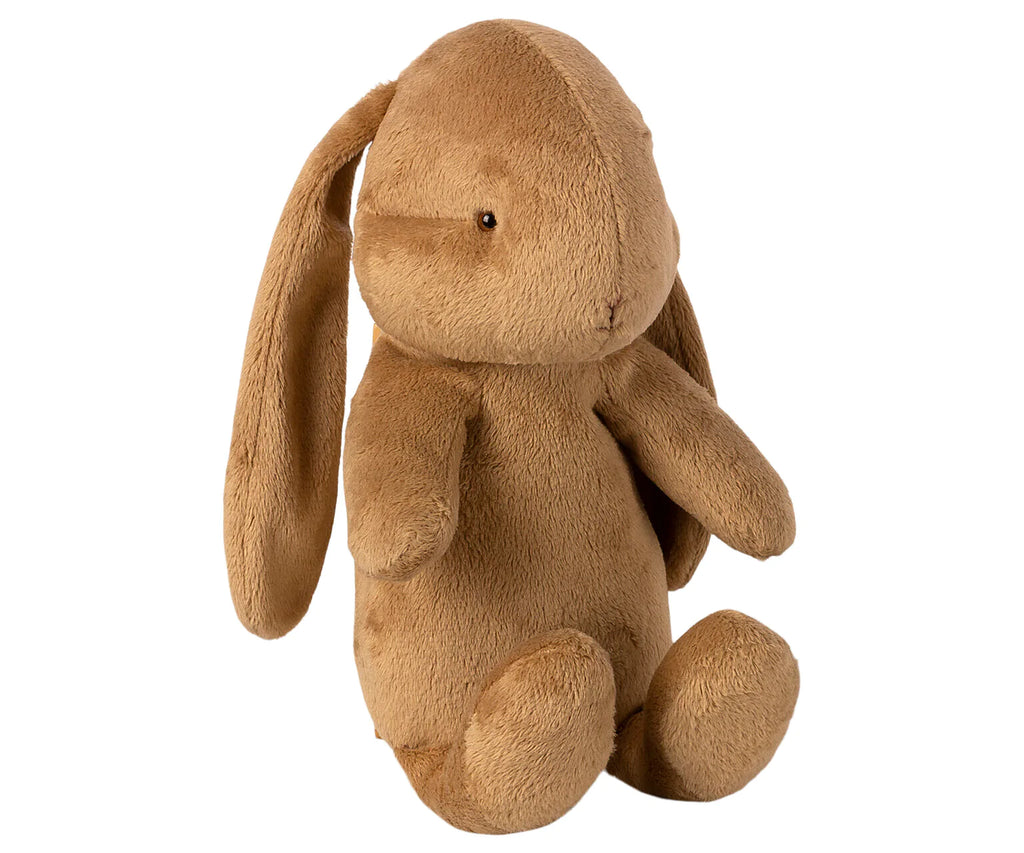 A soft, brown Maileg Bunny Bob with long ears, small black eyes, and a stitched nose. The toy is sitting upright, with its arms and legs slightly outstretched. Maileg Bunny Bob's fur looks soft and cuddly, making it an ideal toy for children.