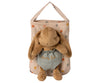 A Maileg Bunny Bob with droopy ears, dressed in a green outfit embroidered with "Bunny Bob," is placed inside a beige fabric polka dot bag. The pouch, adorned with multi-colored polka dots and equipped with a handle for hanging, adds an extra touch of charm.