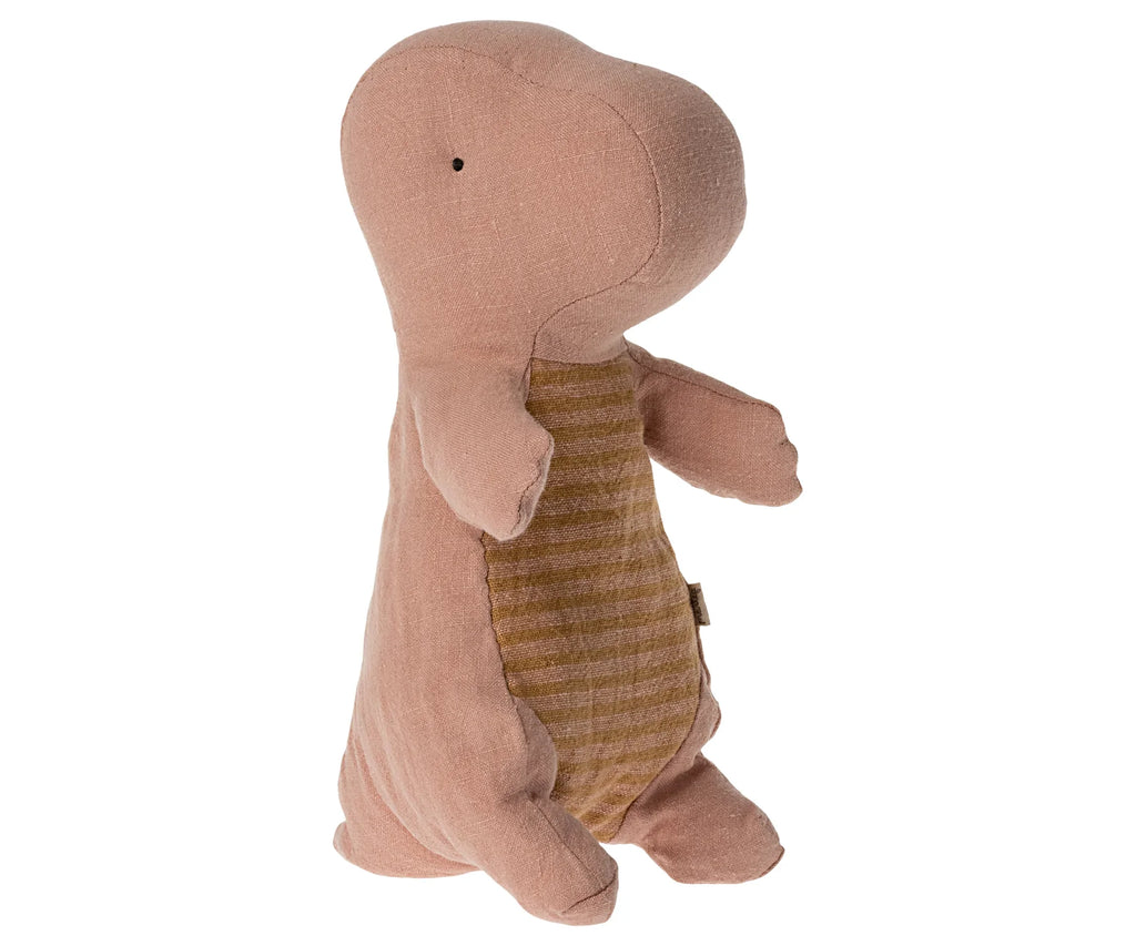 A huggable and cuddly stuffed dinosaur toy with pinkish-brown fabric and a slightly textured surface stands upright. This Maileg Small Gantosaurus in egg - Rose features a round body, small stitched eyes, and a striped beige pattern on its belly.