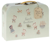 A small, pale green suitcase with a yellow handle features illustrations of playful fawns, a girl with a doll, a toy plane, a ship, a ball, and alphabet blocks. A brown tag attached to the handle reads "Maileg Baby Gift Set," making it perfect as part of a baby gift set.