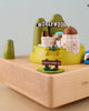 The Los Angeles Wooden Music Box is a small wooden model showcasing iconic Los Angeles landmarks, such as the Hollywood sign, Griffith Park with a mini observatory, and green hills. The base of this perfect gift keepsake has "Los Angeles" engraved on it.