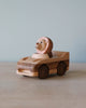 Wooden car toy with a lion as the driver. 