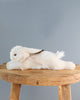 laying white bunny stuffed animal