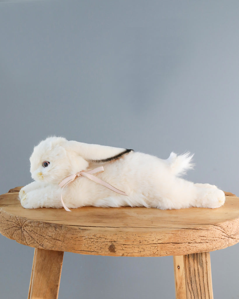 laying white bunny stuffed animal