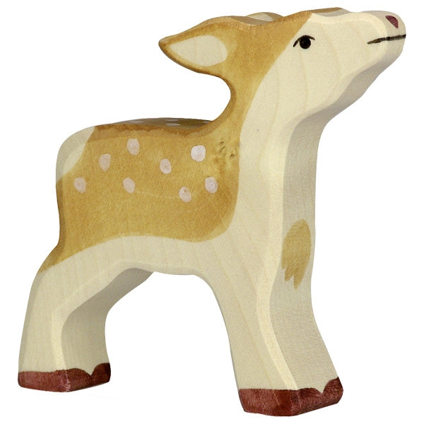 A handcrafted wood figurine of a fawn stands upright. Made in Europe, the Holztiger Fawn has a light tan body with white spots on its back, darker brown accents on its ears and hooves, and a slightly upturned head with a small nose and joyful expression—a perfect addition to your HOLZTIGER figures collection.