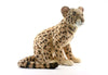 A Leopard Cub Stuffed Animal is sitting on a white background. This hand-sewn plush toy has realistic features with tan fur covered in dark spots, a long tail, and expressive eyes, mimicking a real leopard cub. The attention to detail gives this stuffed animal its unique personality.