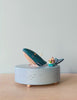 Wooden ocean themed music box with a blue whale in the center and a boat going around it. 