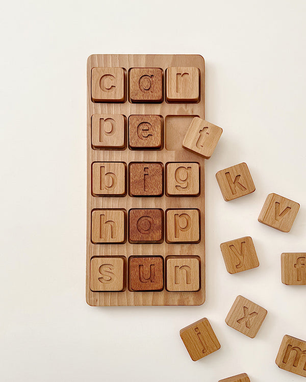 Extra Large CVC Word Kit - Made in USA with letters randomly arranged on a board and some scattered beside it, against a plain light background.