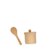 A small wooden doll feeding set with a lid next to a wooden spoon, both set against a plain, dark background.