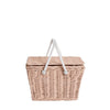 A hand-woven Olli  Ella | Piki Basket picnic basket with a closed lid and white carrying handles, isolated on a white background.