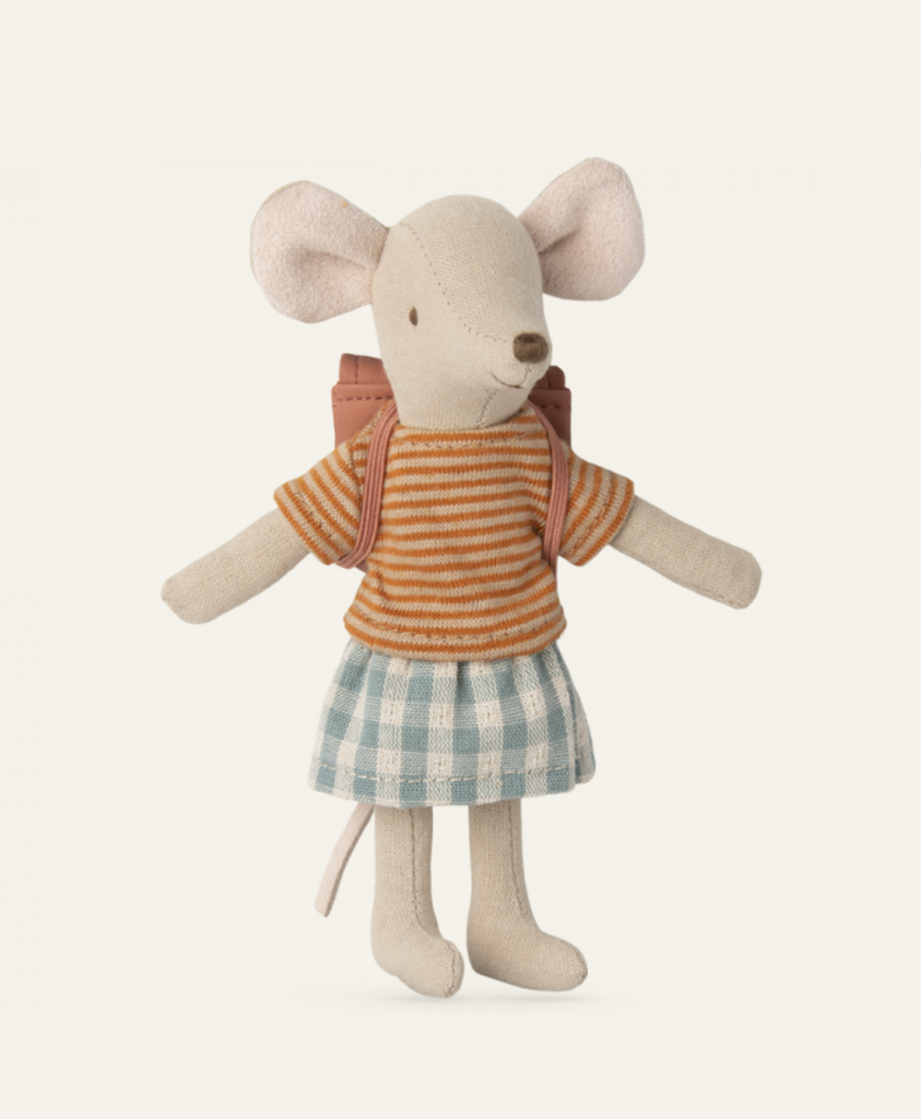 A Maileg Big Sister With Backpack - Old Rose is dressed in an orange and white striped shirt, a blue and white checkered skirt, and a small backpack. The mouse stands upright with arms and legs outstretched.