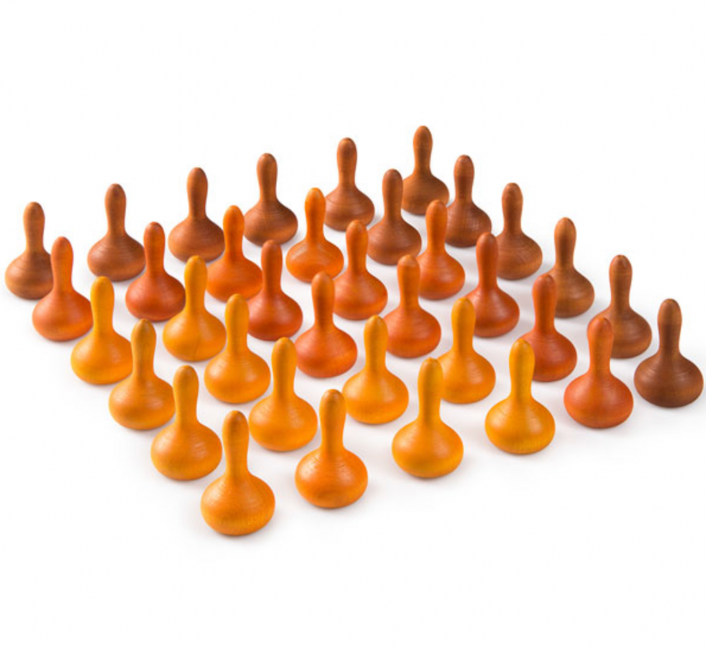 A group of Grapat Mandala Pumpkins organized in a triangular formation on a white background, displaying different shades of brown and autumnal hues.