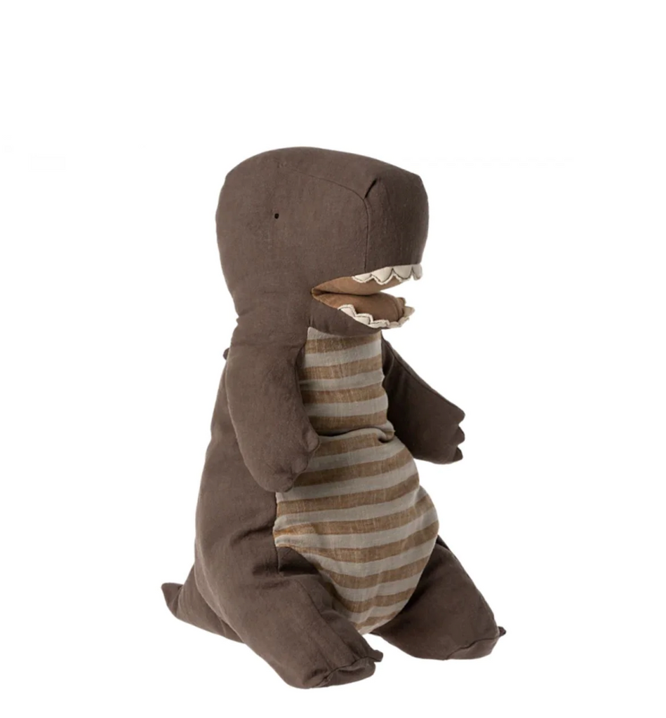 A Maileg Large Dark Green Gantosaurus Dinosaur stands upright, crafted from soft mix fabric. The toy is brown with a lighter brown and beige striped belly. Its mouth is slightly open, revealing small felt teeth. With stubby arms and legs, the toy dinosaur is posed in a sitting position against a plain white background.