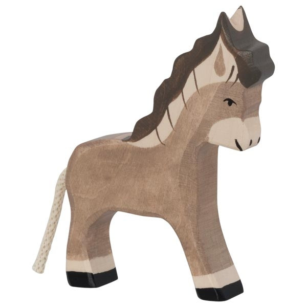 A high-quality wooden toy donkey painted in brown and beige, featuring a textured brown mane and tail. The handcrafted wood donkey has black eyes, black hooves, and a simple, rustic design. Its tail is made of white string. This charming piece is reminiscent of HOLZTIGER figures.