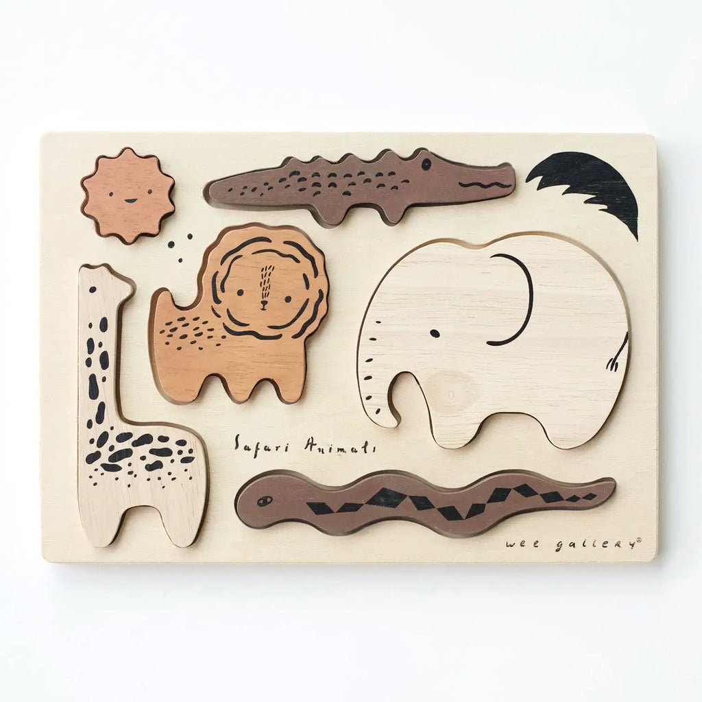 Wooden Tray Puzzle - Safari Animals featuring Safari set animal shapes including a giraffe, elephant, crocodile, lion, and sun, with "Safari animal" text at the bottom.