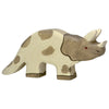 A beige and brown wooden Holztiger Triceratops with three horns and a frill, featuring irregular spots and a small red eye. The texture shows the wood grain, showcasing the quality of HOLZTIGER figures handcrafted in Europe.