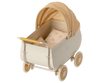 A classic vintage-style Maileg Micro pram in cream with yellow and white plaid fabric on the canopy and white bedding with subtle patterns, set against a light background.