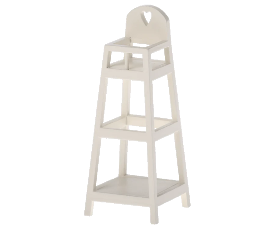 A three-tier, white Maileg My High Chair with a minimalist design, perfect for nursery furniture. Each level is square-shaped and progressively smaller from bottom to top. The top tier has an arch-shaped cut-out handle. The stand is on four legs, providing open space between the tiers.