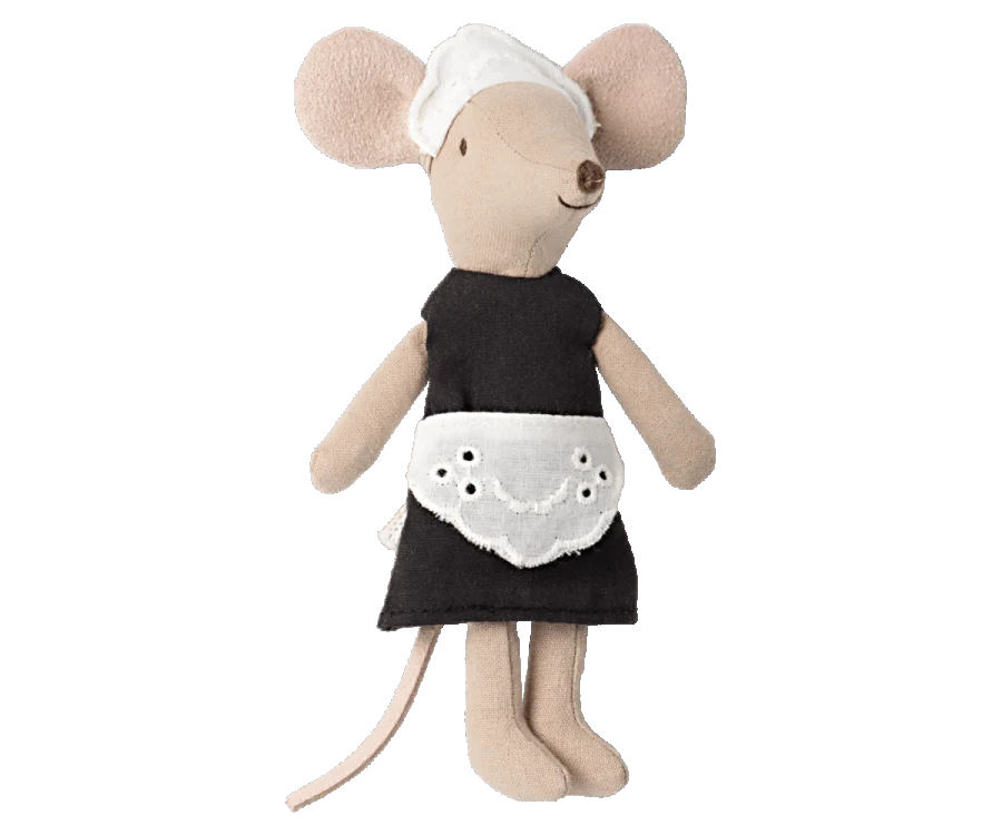 A Maileg Maid Mouse classically dressed as a maid with magnets in its hands. The mouse is wearing a black dress with a white apron and headpiece, featuring a long tail and large, round ears.