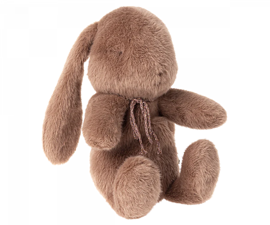 Brown plush bunny with bow around its neck. 